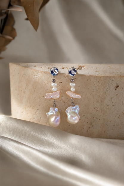 High Luster Freshwater Pearl dangle earrings in an elegant still-life luxury setting