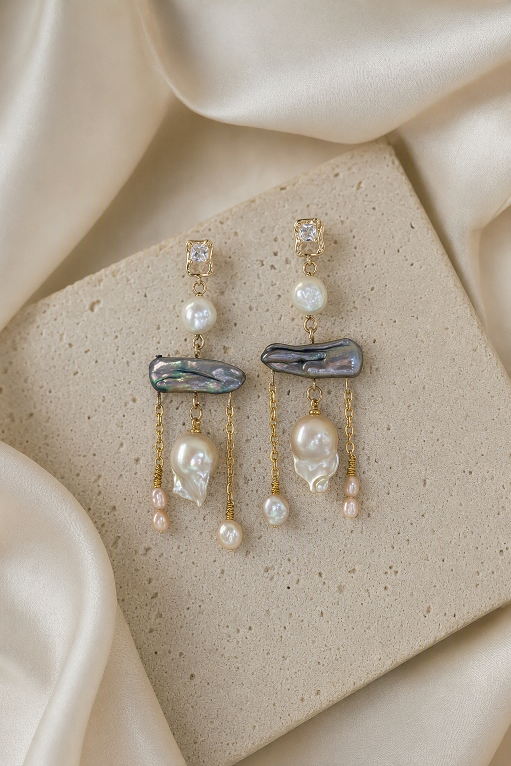 High Luster Freshwater Pearl dangle earrings in an elegant still-life luxury setting
