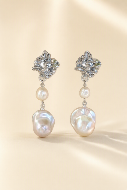 High Luster Freshwater Pearl drop earrings on a cream white background