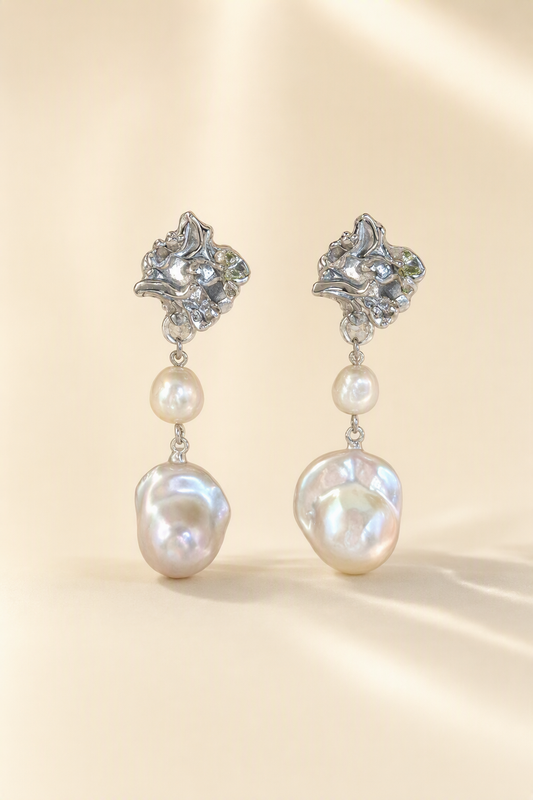 High Luster Freshwater Pearl drop earrings on a cream white background