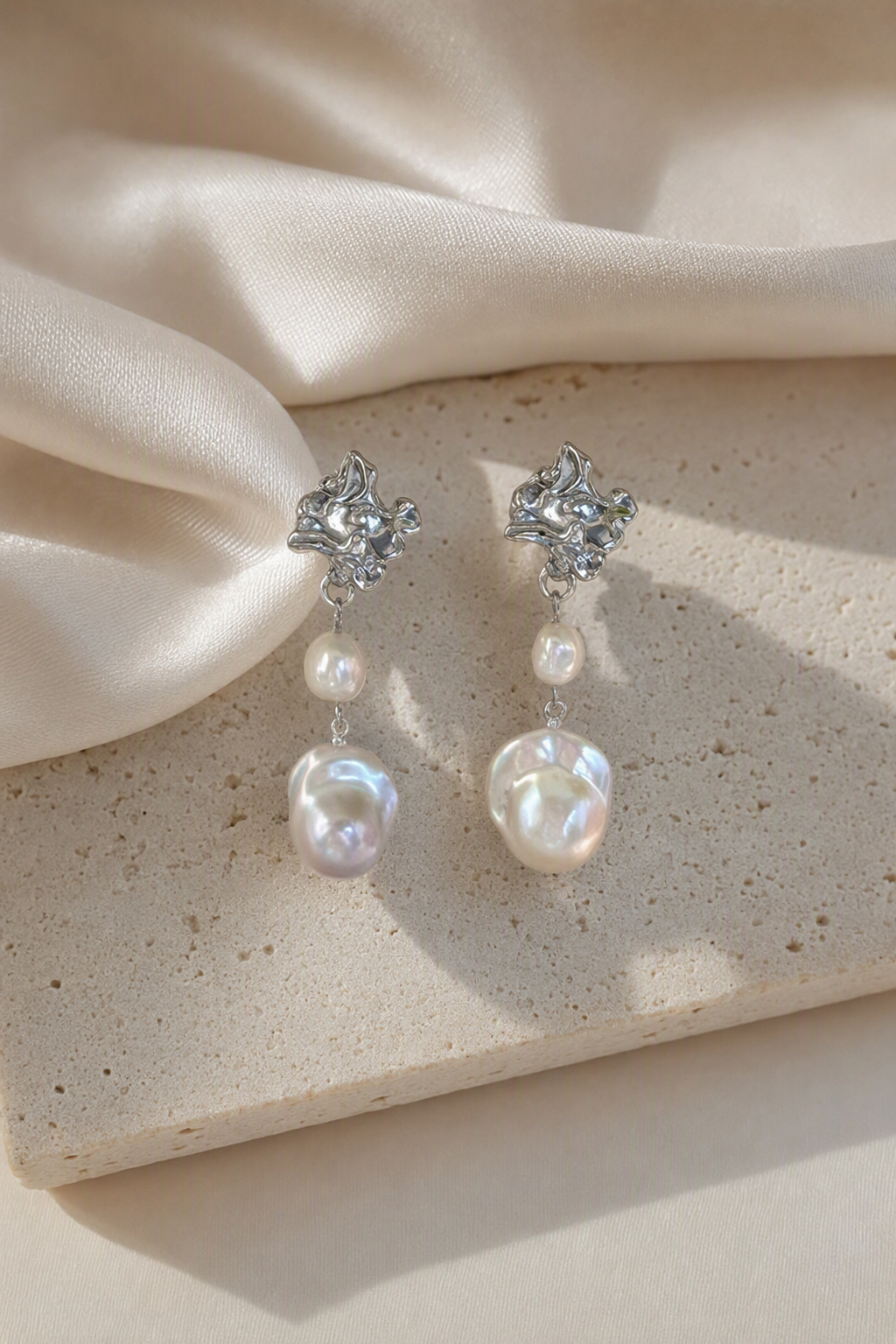 High Luster Freshwater Pearl drop earrings in an elegant still-life luxury setting