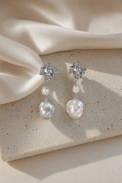 High Luster Freshwater Pearl drop earrings in an elegant still-life luxury setting