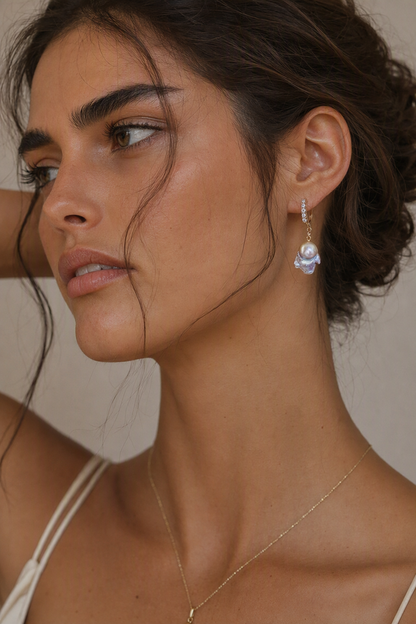 Model wearing High Luster Freshwater Pearl drop earrings naturally on the earlobe