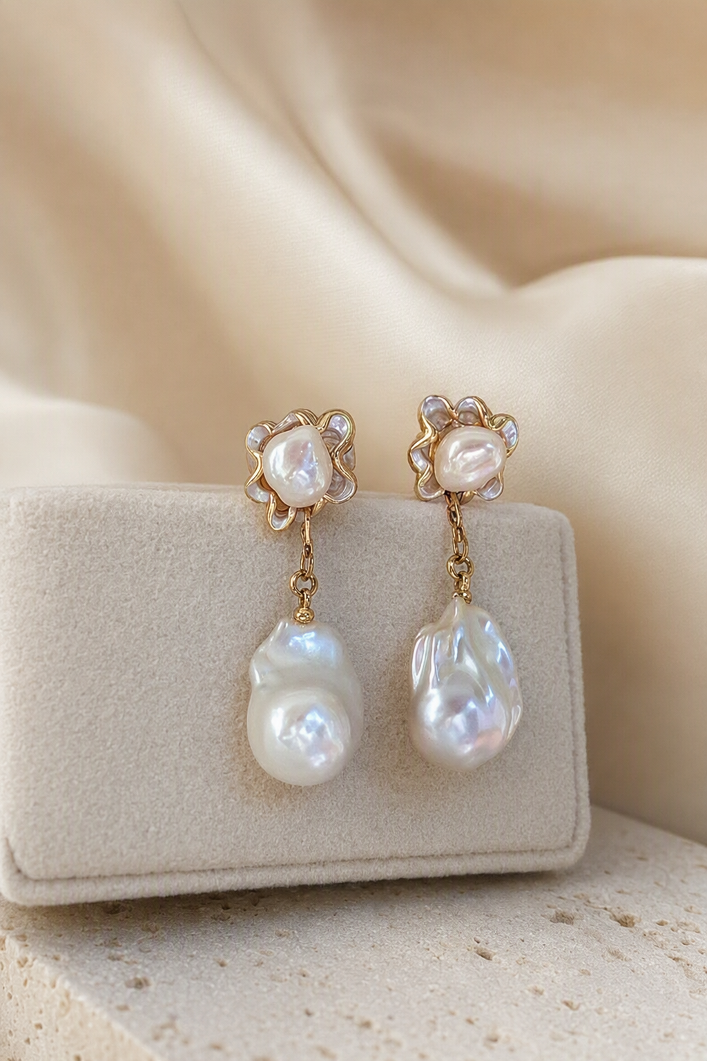 High Luster Freshwater Pearl drop earrings in an elegant still-life luxury setting