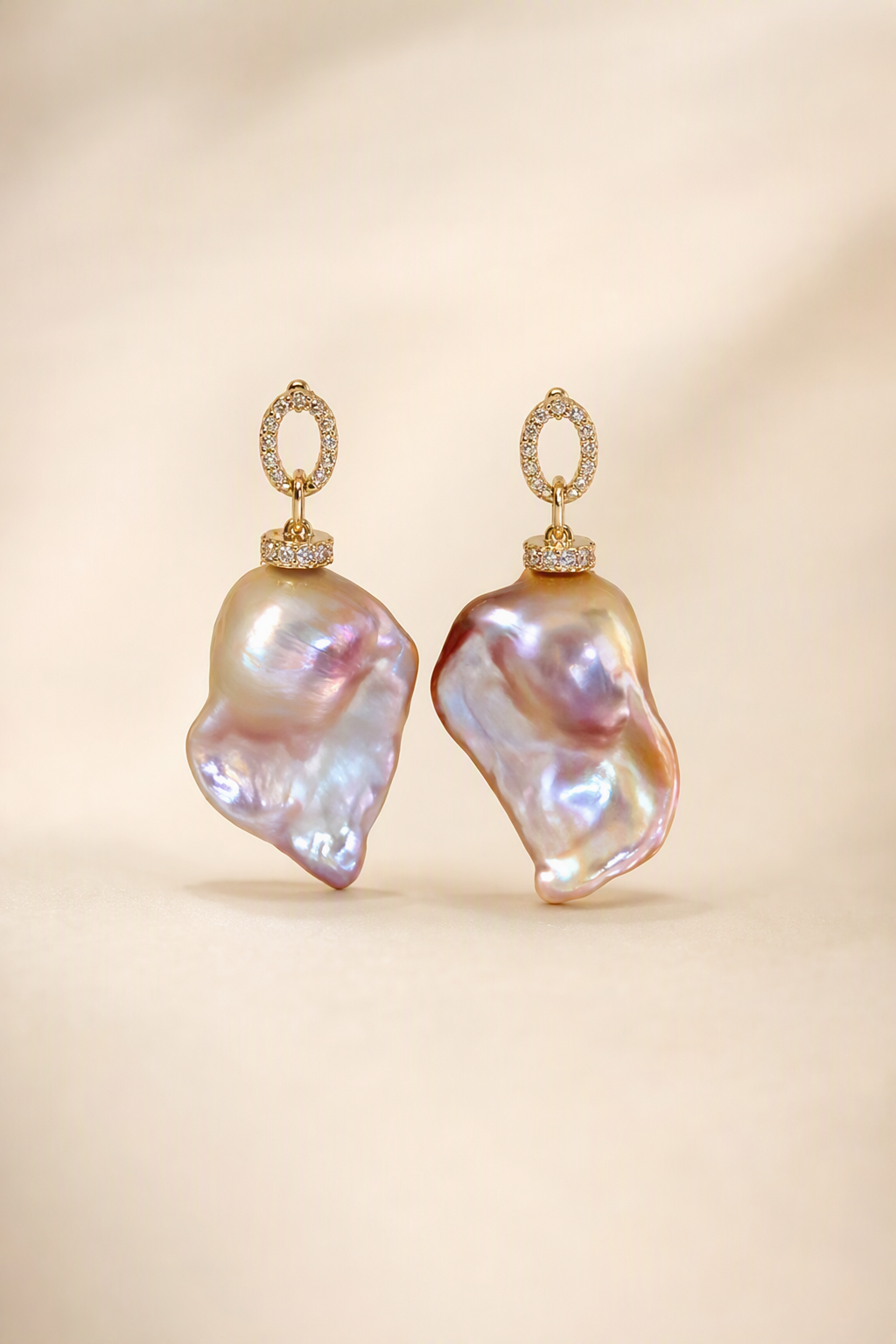 High Luster Freshwater Pearl drop earrings on a cream white background