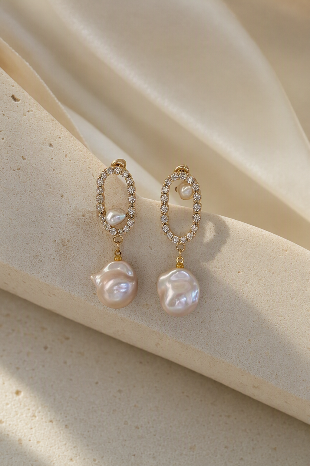 High Luster Freshwater Pearl drop earrings in an elegant still-life luxury setting