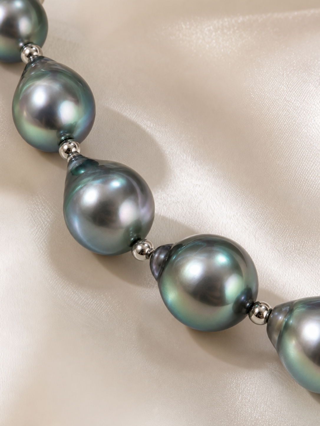 Close-up of black Tahitian pearl necklace showing mirror-like luster and high nacre quality