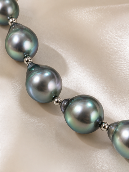 Close-up of black Tahitian pearl necklace showing mirror-like luster and high nacre quality
