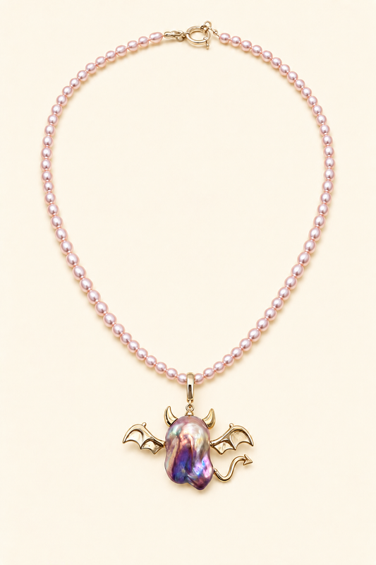 Horned Winged Devil baroque pearl pendant with a pink small pearl necklace by Pearlivo