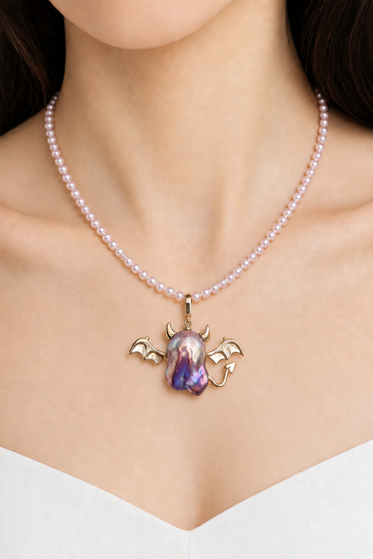 Model wearing the Horned Winged Devil baroque pearl pendant necklace by Pearlivo