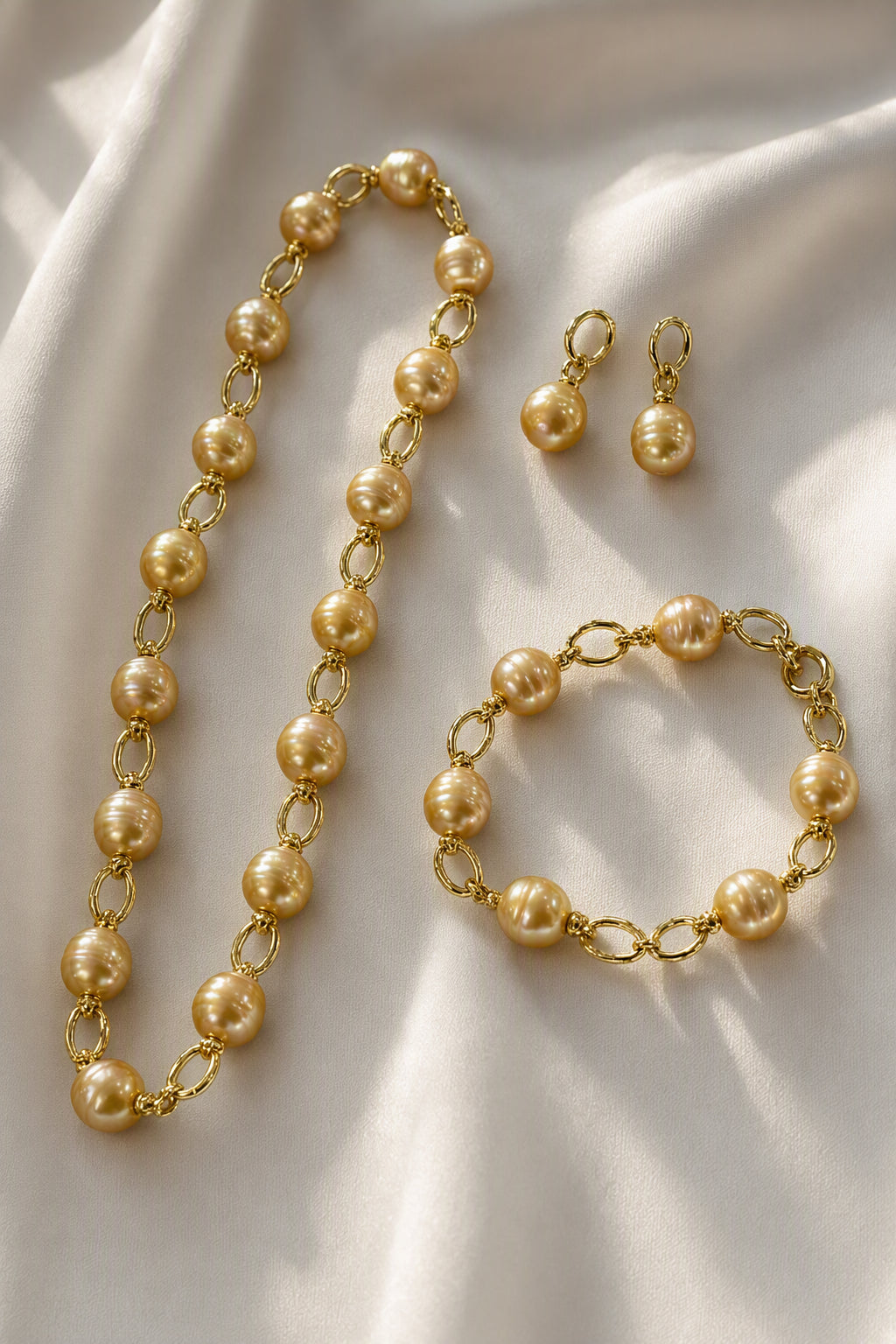 Golden South Sea Pearl Necklace Bracelet and Earrings Set — luxury still life