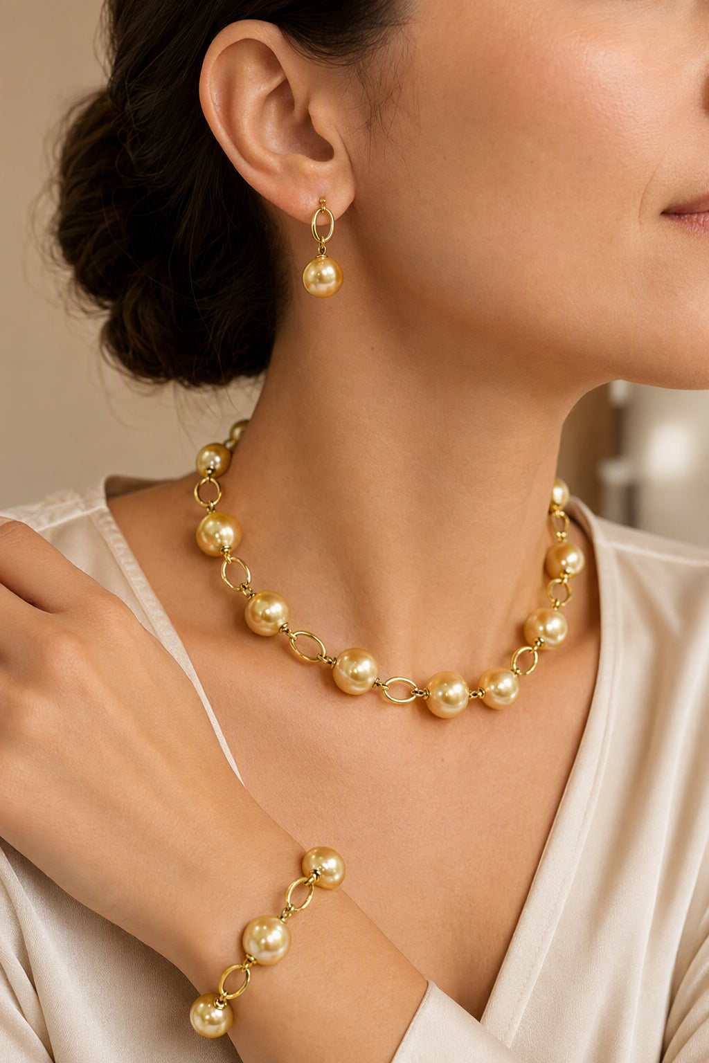 Golden South Sea Pearl Necklace Bracelet and Earrings Set — earrings wearing and set styling view