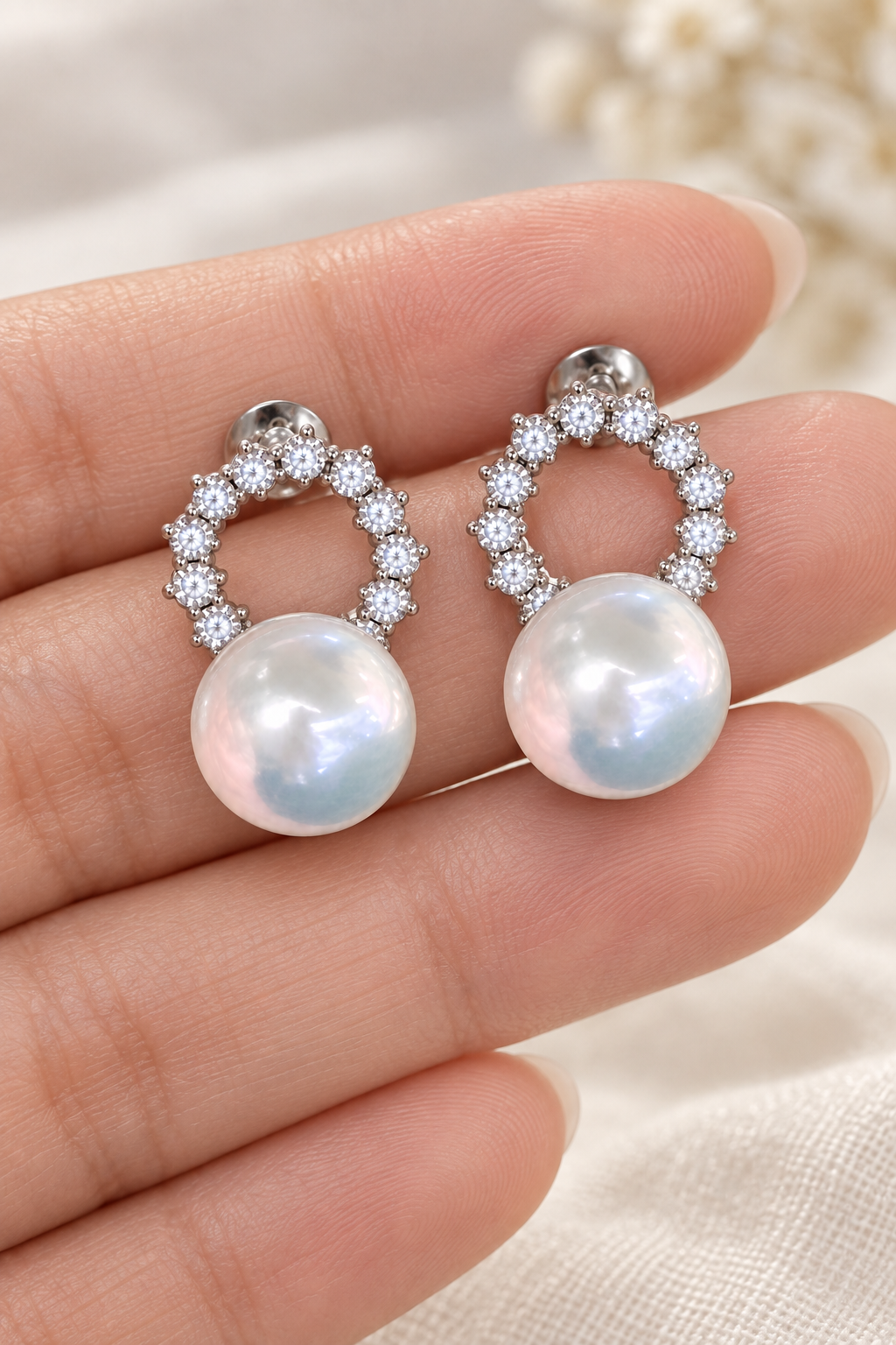 Gem Luster 11–13 mm Australian South Sea Pearl stud earrings in an elegant still-life luxury setting