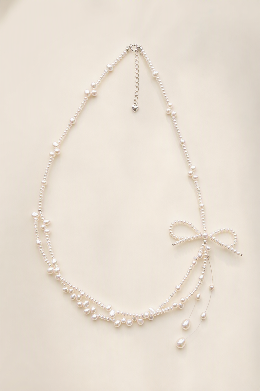 3–4 mm and 5–6 mm Freshwater Pearl necklace on a cream white background