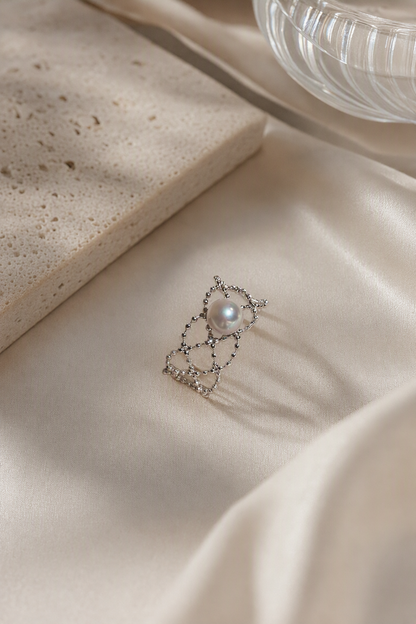 Aurora Luster 5-6mm ring in an elegant still-life luxury setting