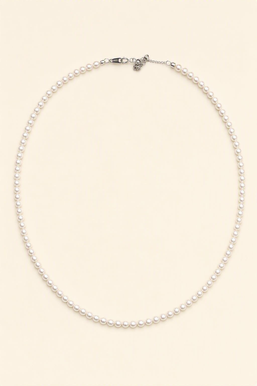 Mirror Luster 2–3mm Cultured Freshwater Pearl necklace on a cream white background