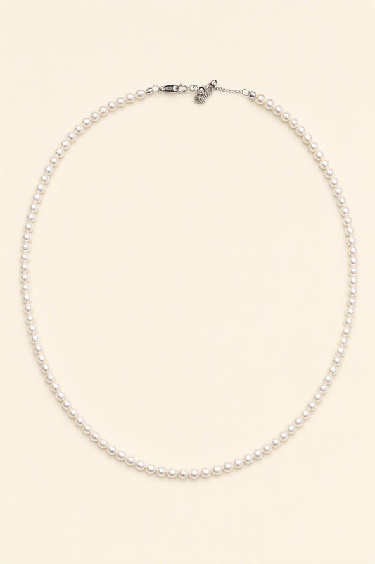 Mirror Luster 2–3mm Cultured Freshwater Pearl necklace on a cream white background