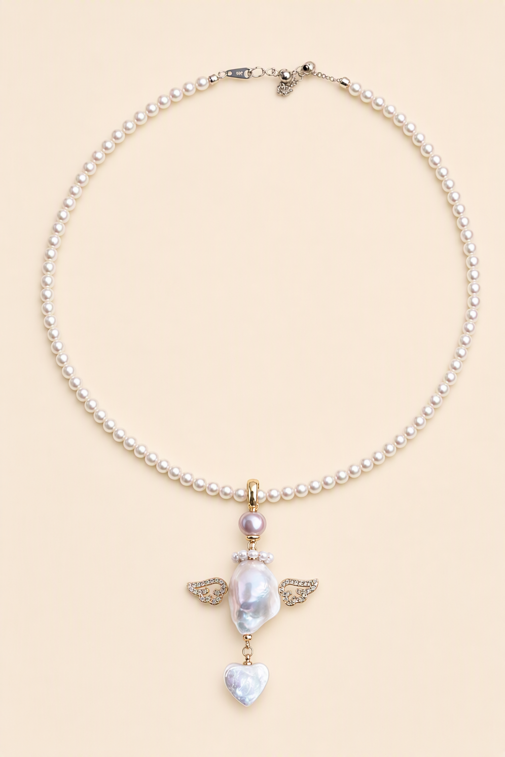 Crystal Wing Heart Drop baroque pearl pendant with a white small pearl necklace by Pearlivo