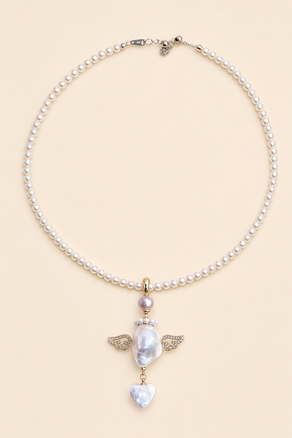 Crystal Wing Heart Drop baroque pearl pendant with a white small pearl necklace by Pearlivo