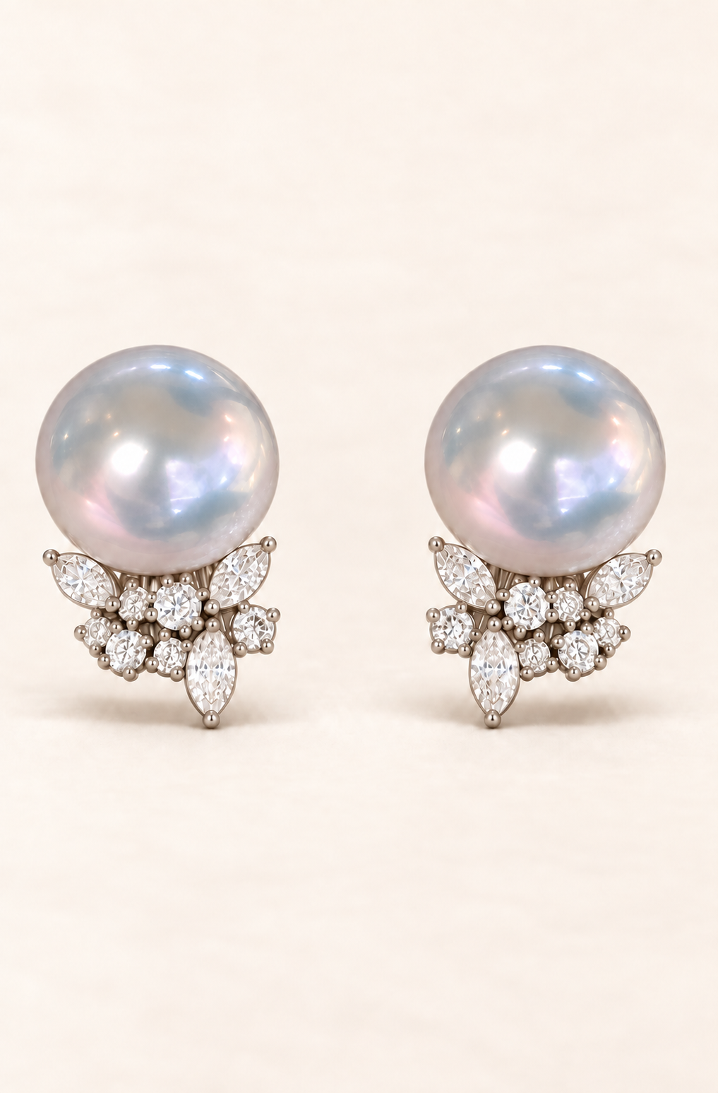 Gem Luster 11–13 mm Australian South Sea Pearl stud earrings on a cream white background