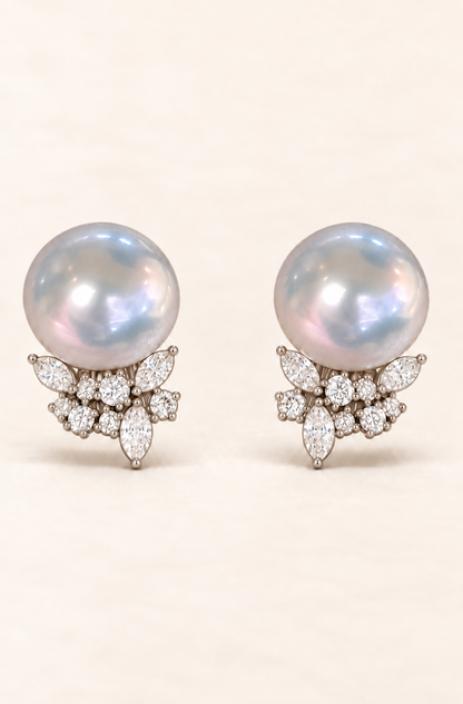 Gem Luster 11–13 mm Australian South Sea Pearl stud earrings on a cream white background