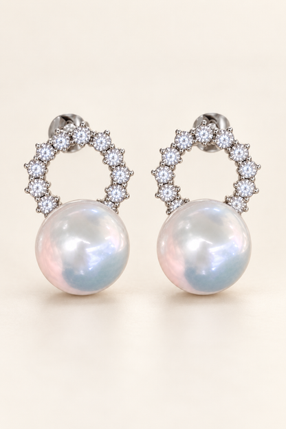 Gem Luster 11–13 mm Australian South Sea Pearl stud earrings on a cream white background
