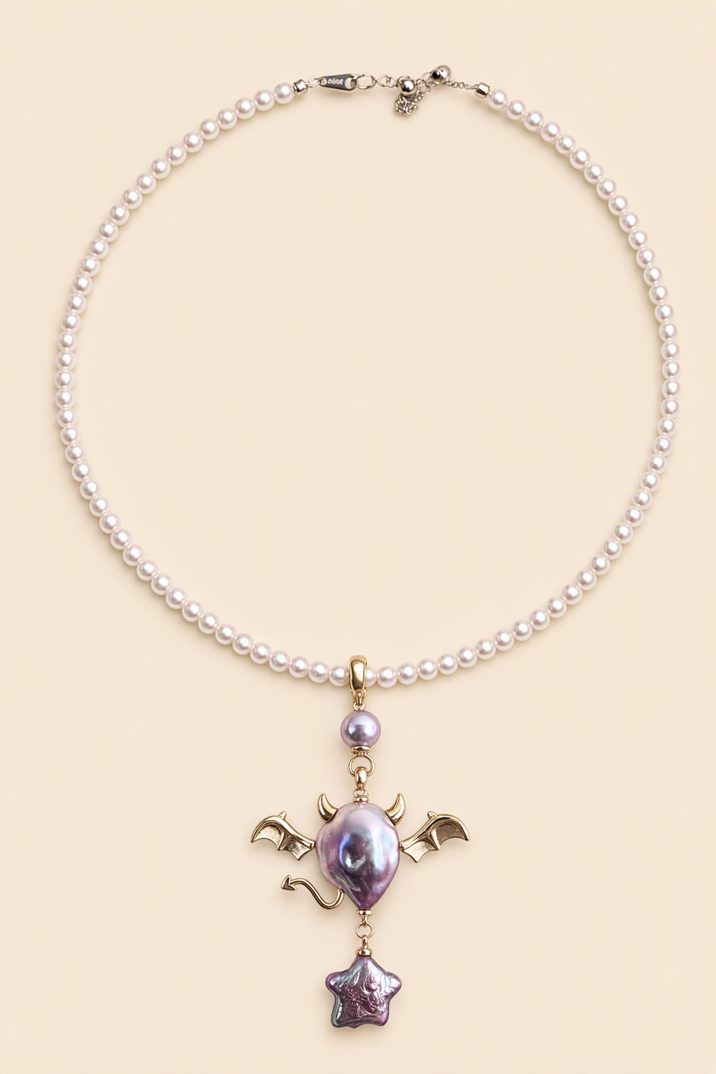 Purple Bat Devil Star Drop baroque pearl pendant with a pink small pearl necklace by Pearlivo
