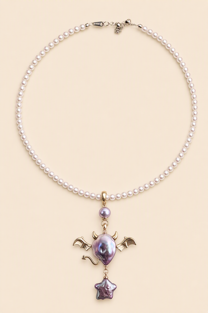Purple Bat Devil Star Drop baroque pearl pendant with a pink small pearl necklace by Pearlivo