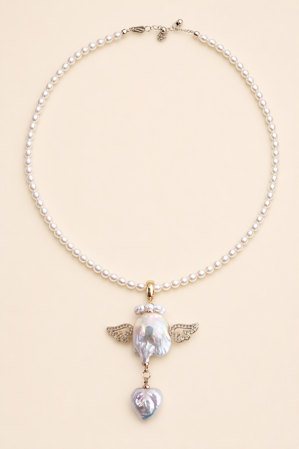 Winged Angel Heart Drop baroque pearl pendant with a white small pearl necklace by Pearlivo
