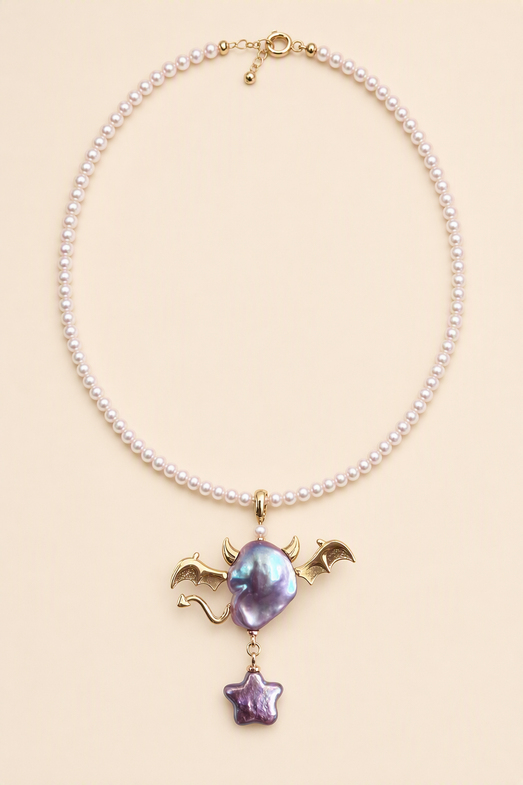 Bat Horn Devil Star Drop baroque pearl pendant with a pink small pearl necklace by Pearlivo