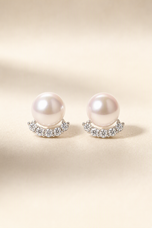 Mirror Luster 10–13 mm Freshwater Pearl stud earrings on a cream white background
