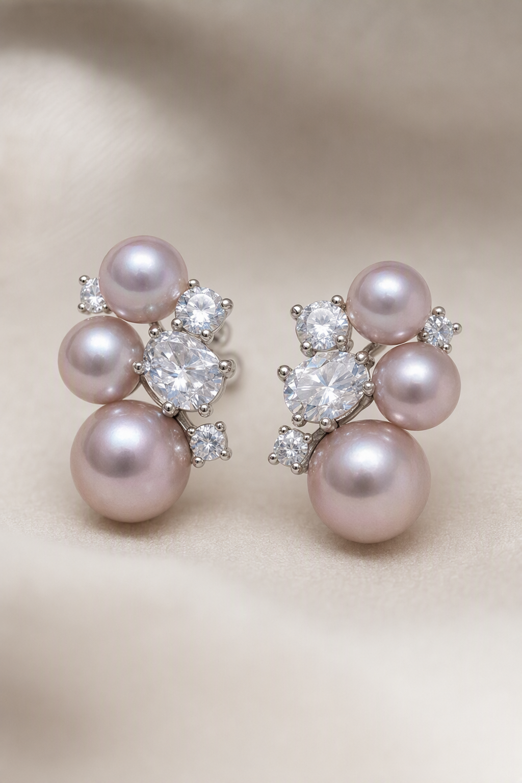 Close-up of Mirror Luster 4–10 mm Graduated Freshwater Pearl stud earrings showing pearl luster, nacre and craftsmanship detail