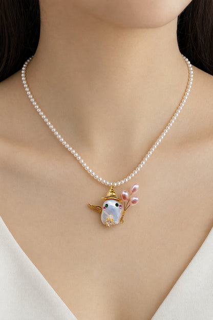 Western model wearing the Winged Ghost with Pink Pearl Stems Halloween baroque pearl pendant necklace by Pearlivo