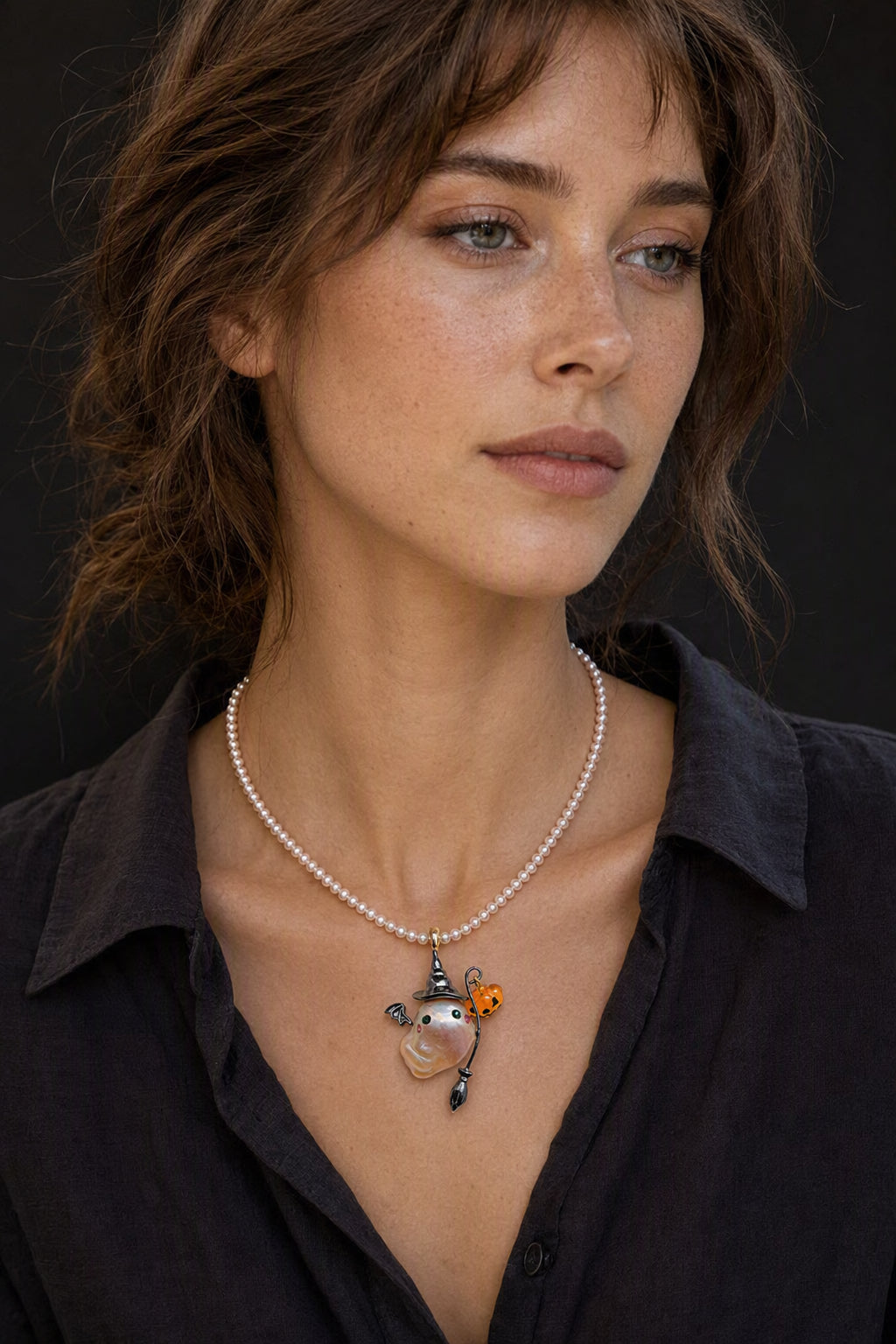 Western model wearing the Witch Ghost with Pumpkin and Broom Halloween baroque pearl pendant necklace by Pearlivo