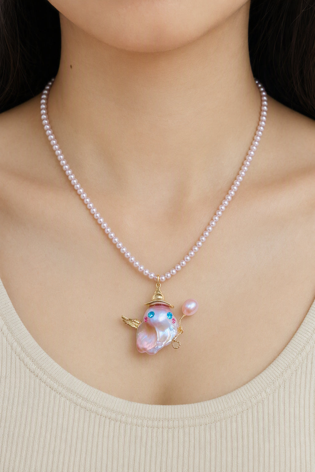 Western model wearing the Winged Unicorn Ghost with Balloon Halloween baroque pearl pendant necklace by Pearlivo