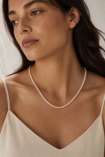 Mirror Luster 2–3mm Cultured Freshwater Pearl necklace in an elegant still-life luxury setting