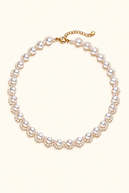 Mirror Luster Main pearls 5–6 mm; small pearls 2–3 mm Freshwater Pearl necklace on a cream white background