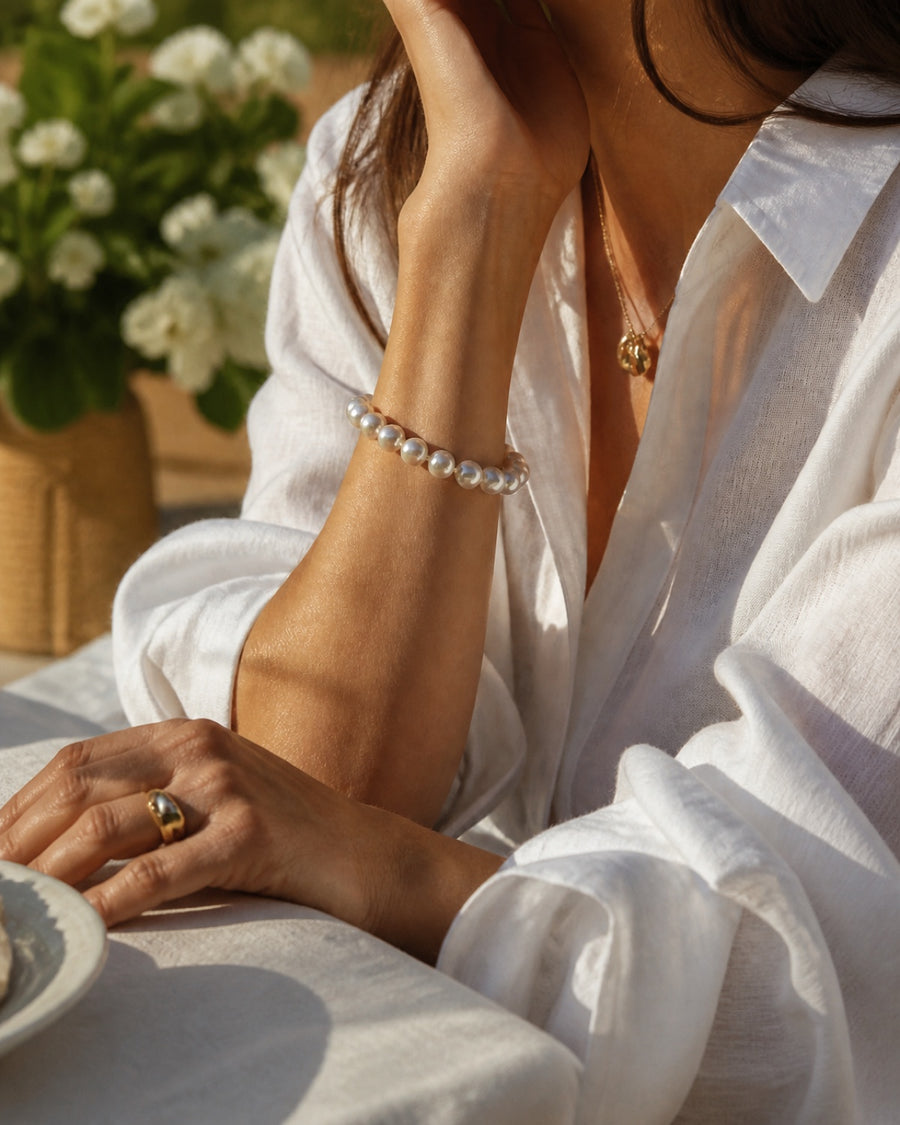 Real pearl bracelet styled with white linen
