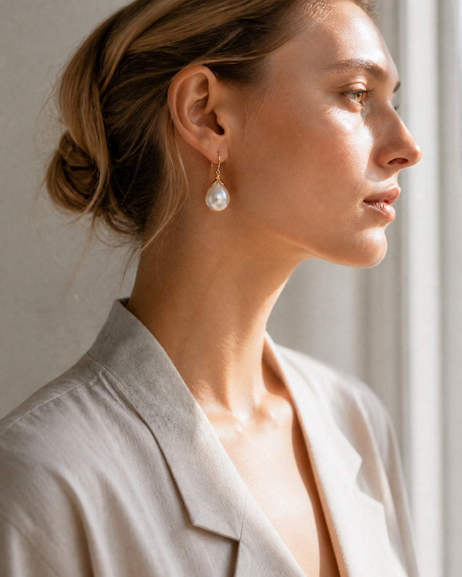 Real pearl drop earrings in soft daylight