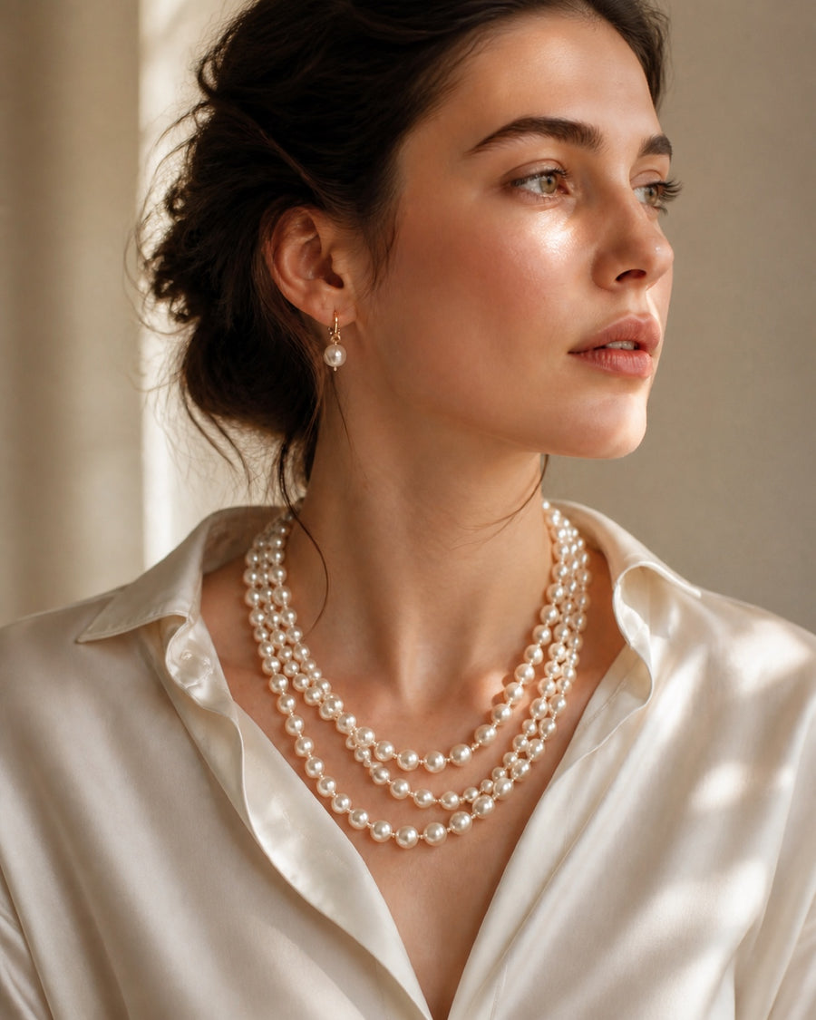 Real pearl necklaces worn with quiet elegance