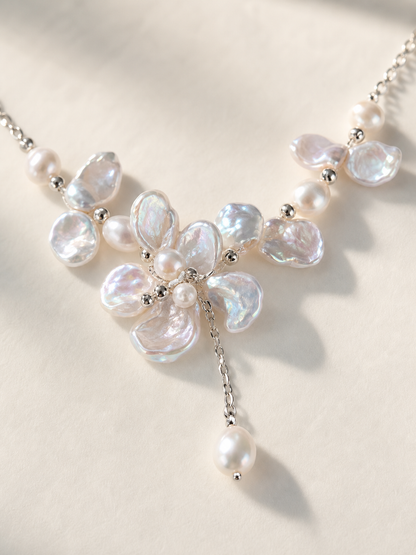 Freshwater pearl necklace featuring white baroque pearls with mirror luster and aurora overtone