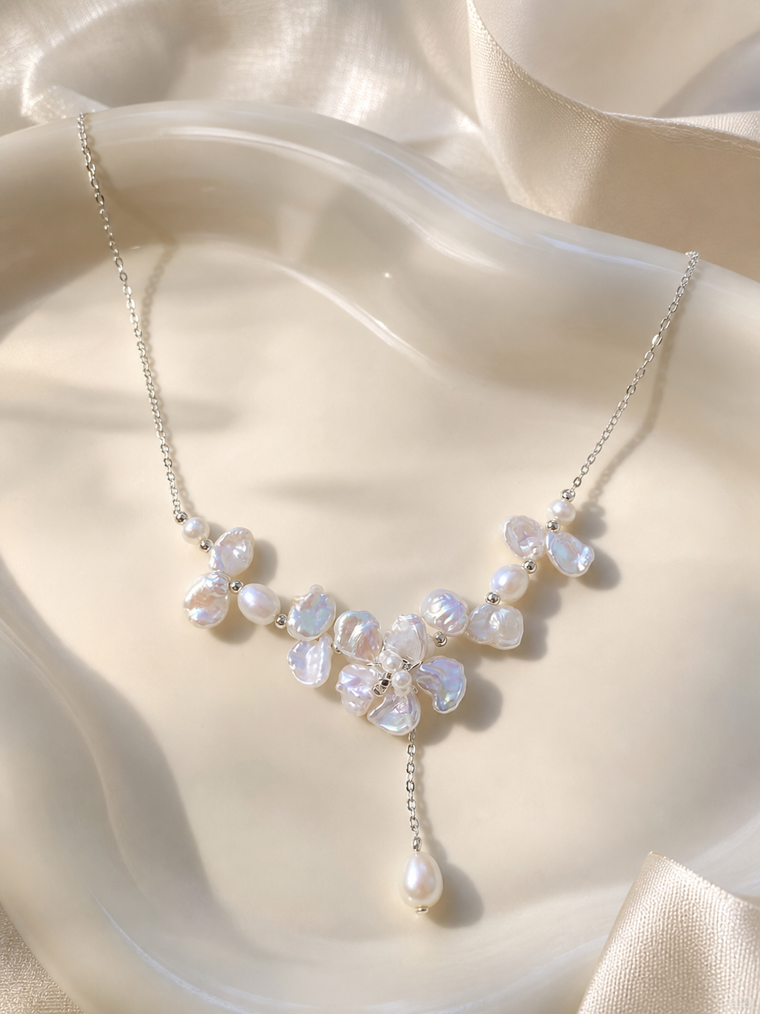 White baroque freshwater pearl necklace with floral cluster design and mirror-like luster