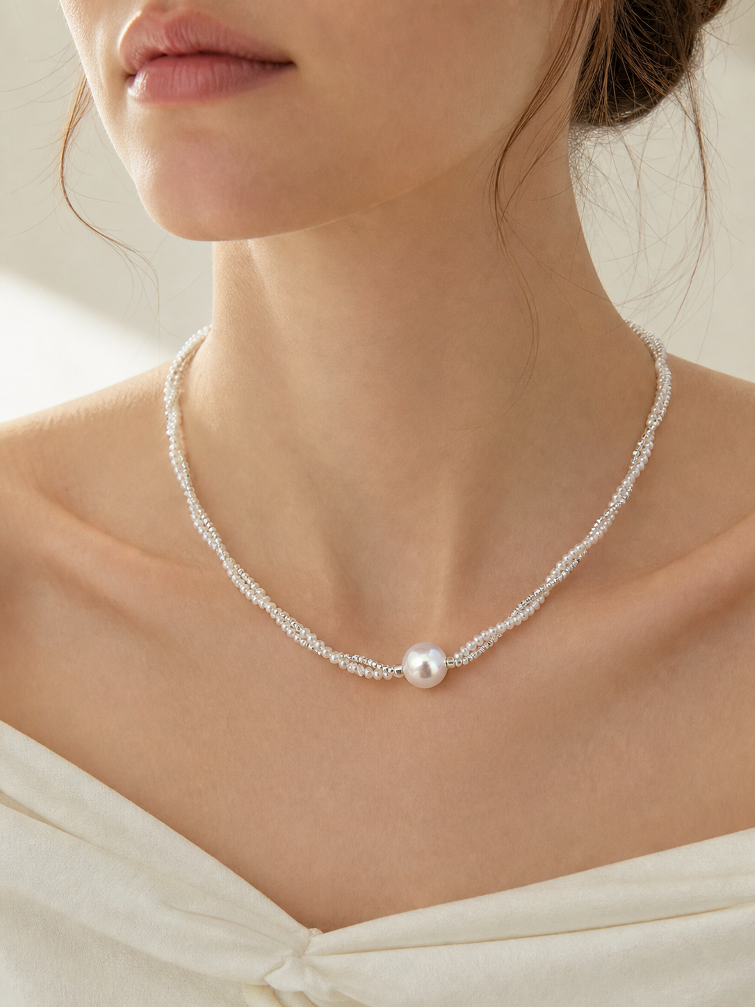 real freshwater cultured pearls necklace with silver accents and luminous mirror-like pearl glow