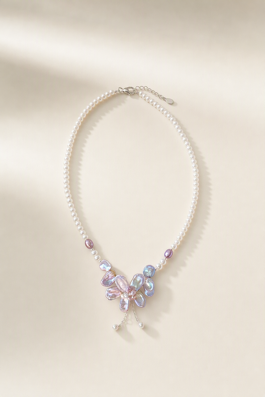 3-12mm Freshwater Pearl necklace on a cream white background