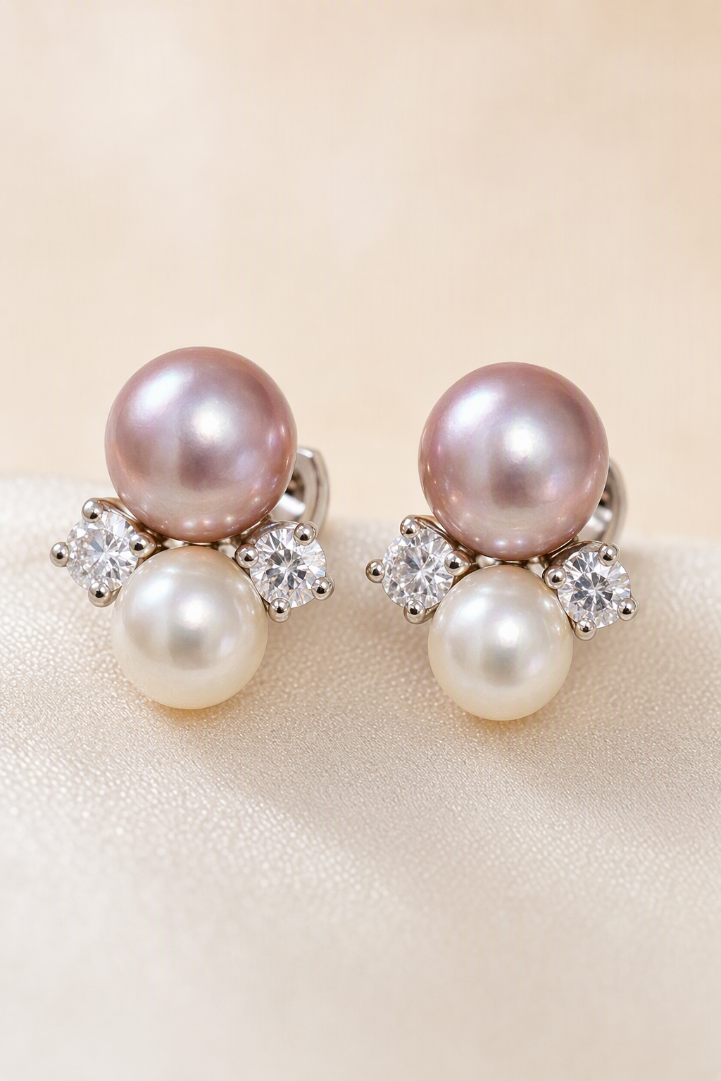 Close-up of Mirror Luster 9–10 mm purple pearl with 6–7 mm white pearl Freshwater Pearl stud earrings showing pearl luster, nacre and craftsmanship detail