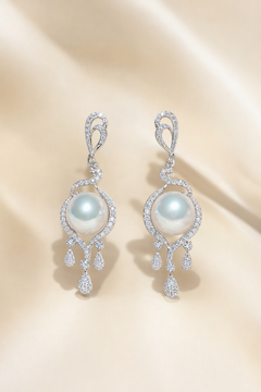 Venus Luster 11-12mm Australian South Sea Pearl stud earrings on a cream white background