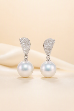 Venus Luster 11-12mm Australian South Sea Pearl Stud Earrings on a cream white primary background