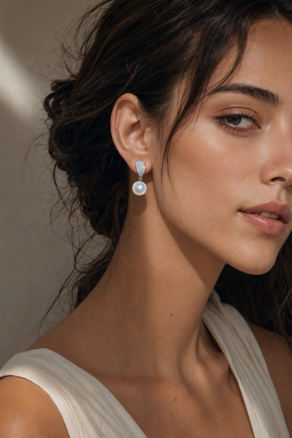 Venus Luster 11-12mm Australian South Sea Pearl Stud Earrings naturally worn on the earlobe by a model