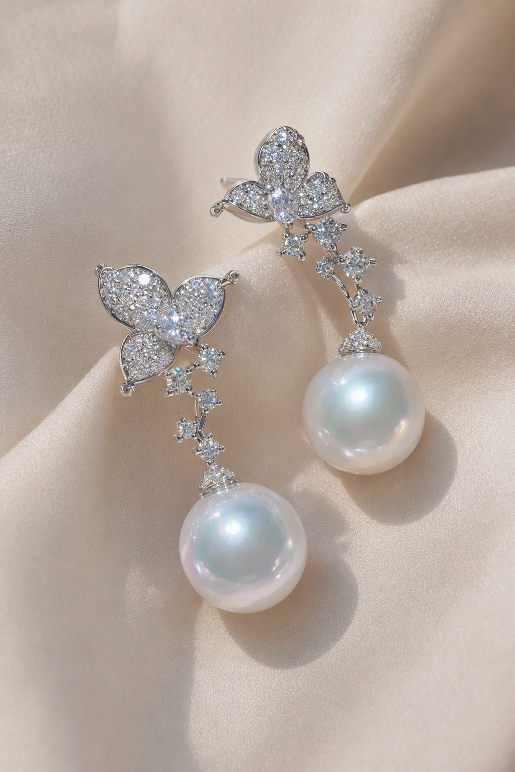 Close-up of Venus Luster 11-12mm Australian South Sea Pearl stud earrings showing pearl luster, nacre and craftsmanship detail