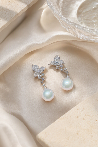 Venus Luster 11-12mm Australian South Sea Pearl stud earrings in an elegant still-life luxury setting